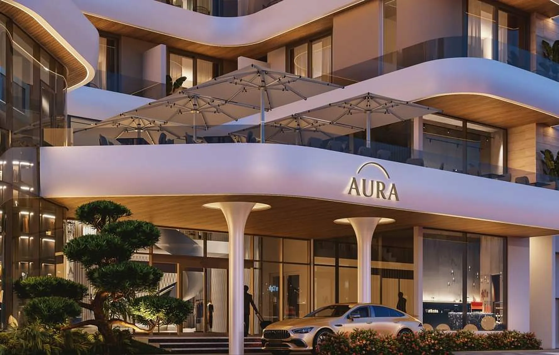 Hotel entrance under a sculpted canopy with planting