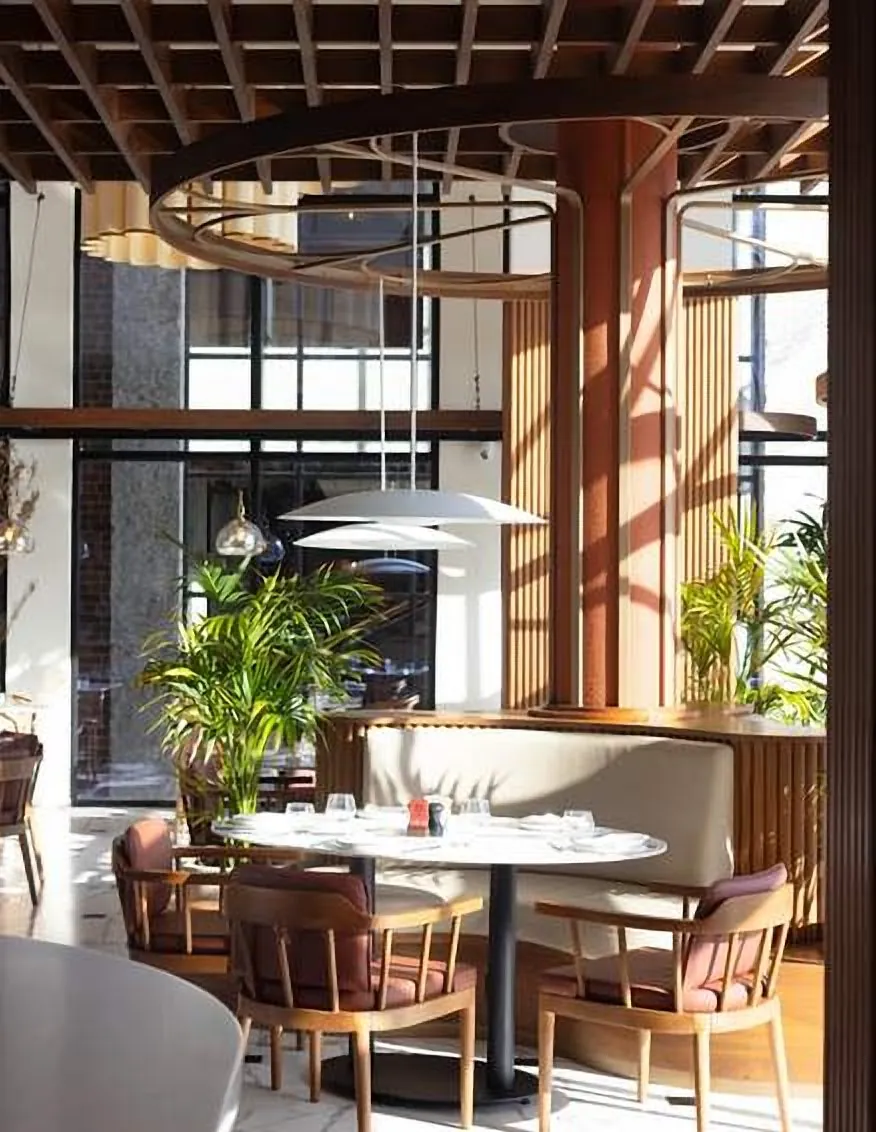 Window table under brass pendants
