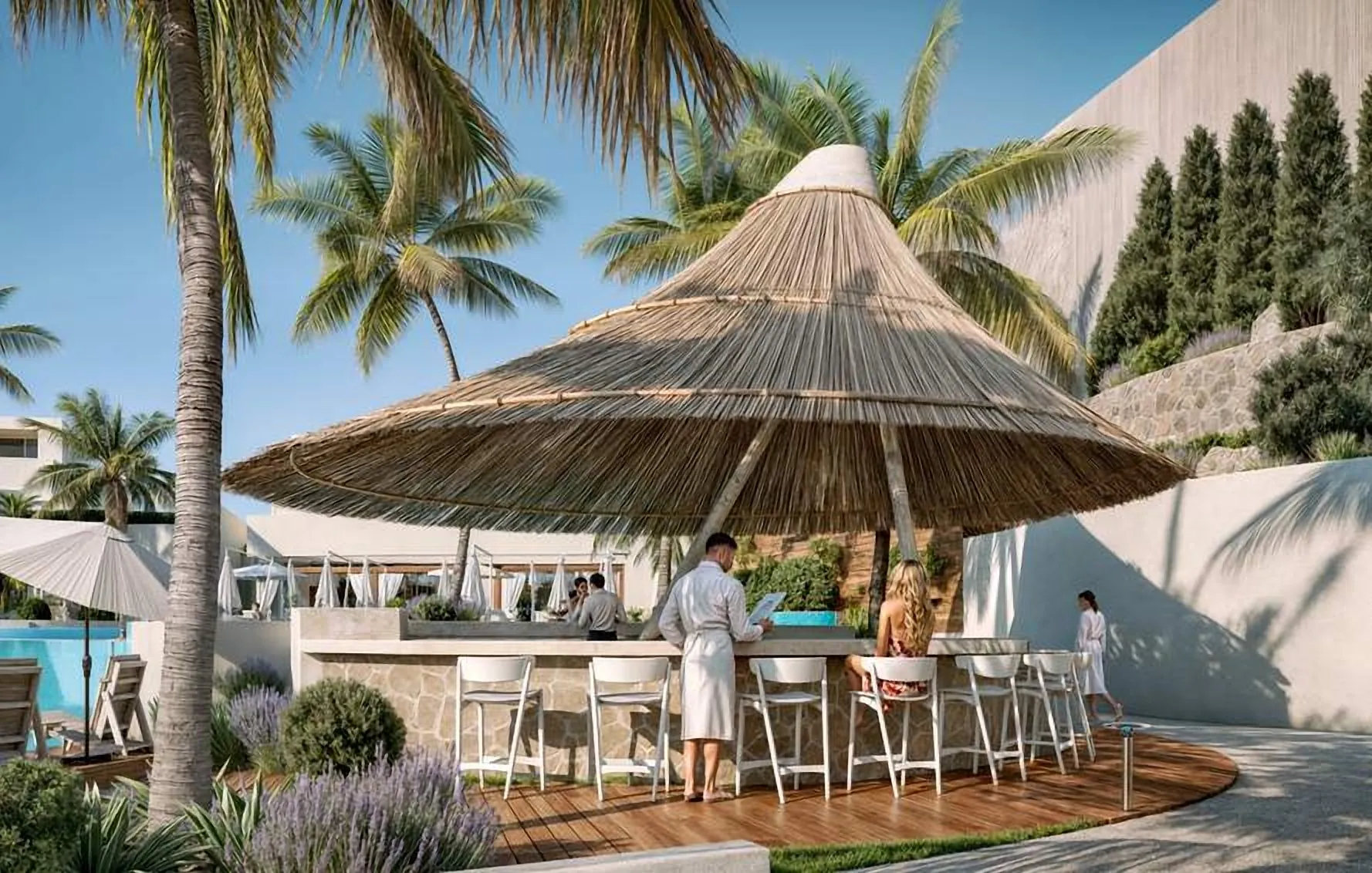 Thatched pool bar with stools under palms