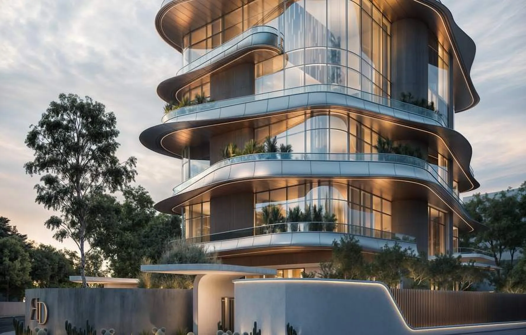 Curved balconies and glazing at dusk