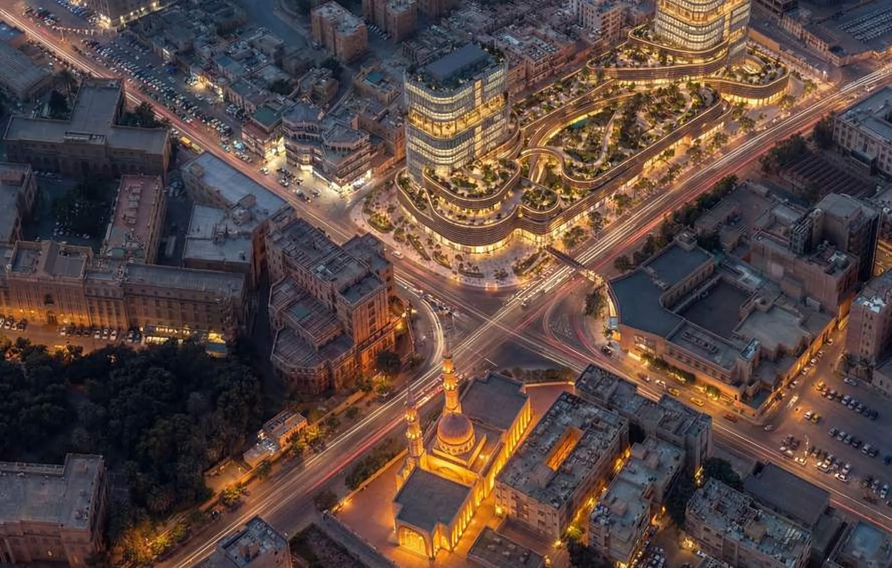 Aerial night view of the development in the city grid