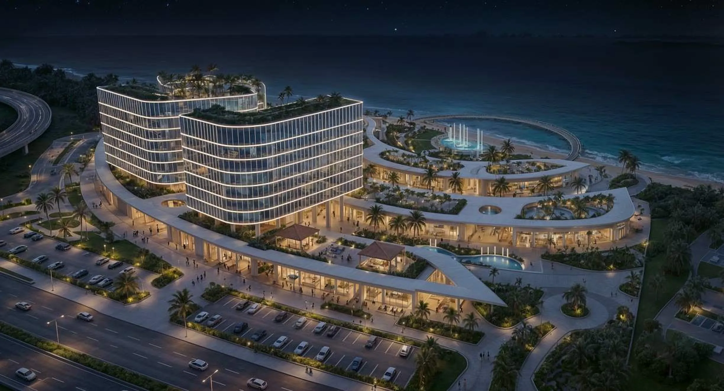 Night aerial of curved waterfront buildings