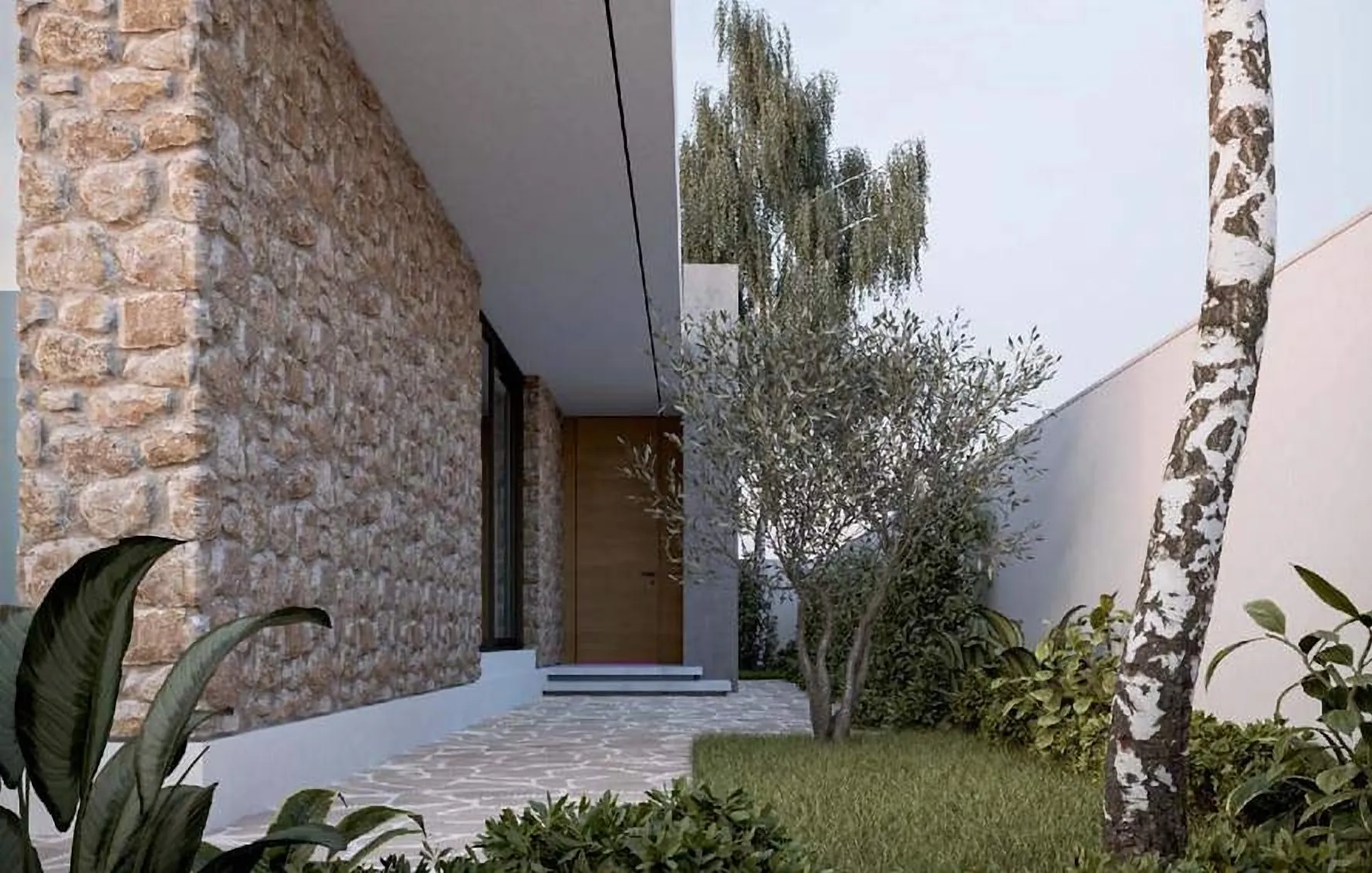 Natural stone wall and timber door in a planted entrance court