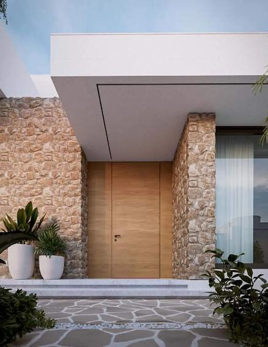 Stone-clad entrance under a white cantilever